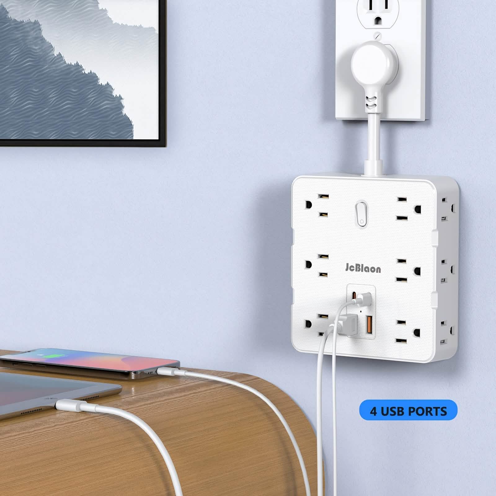 Wall-mounted power strip with multiple outlets and USB ports, connected to a wall socket.
