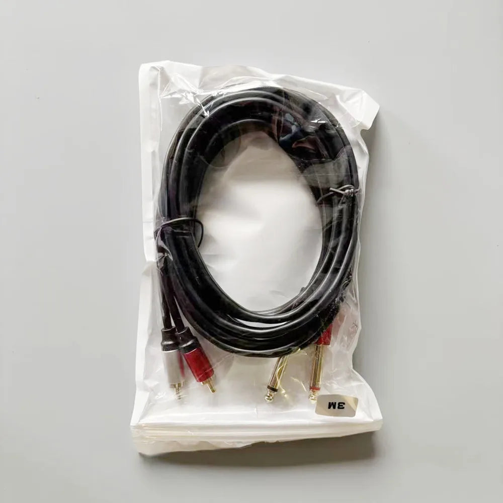 Cable with red and gold connectors in a clear plastic bag on a gray background