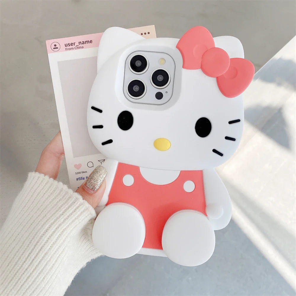 Hello Kitty phone case held by a person with a blurred background