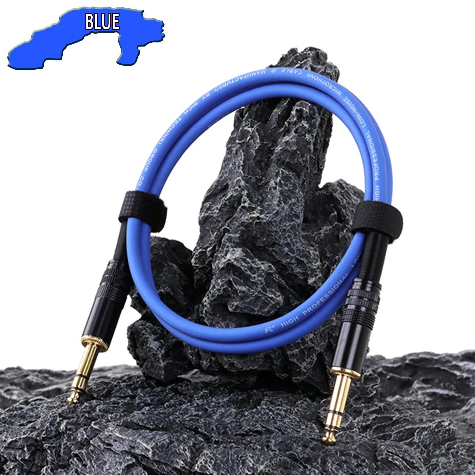 Blue audio cable with black connectors on a rocky surface
