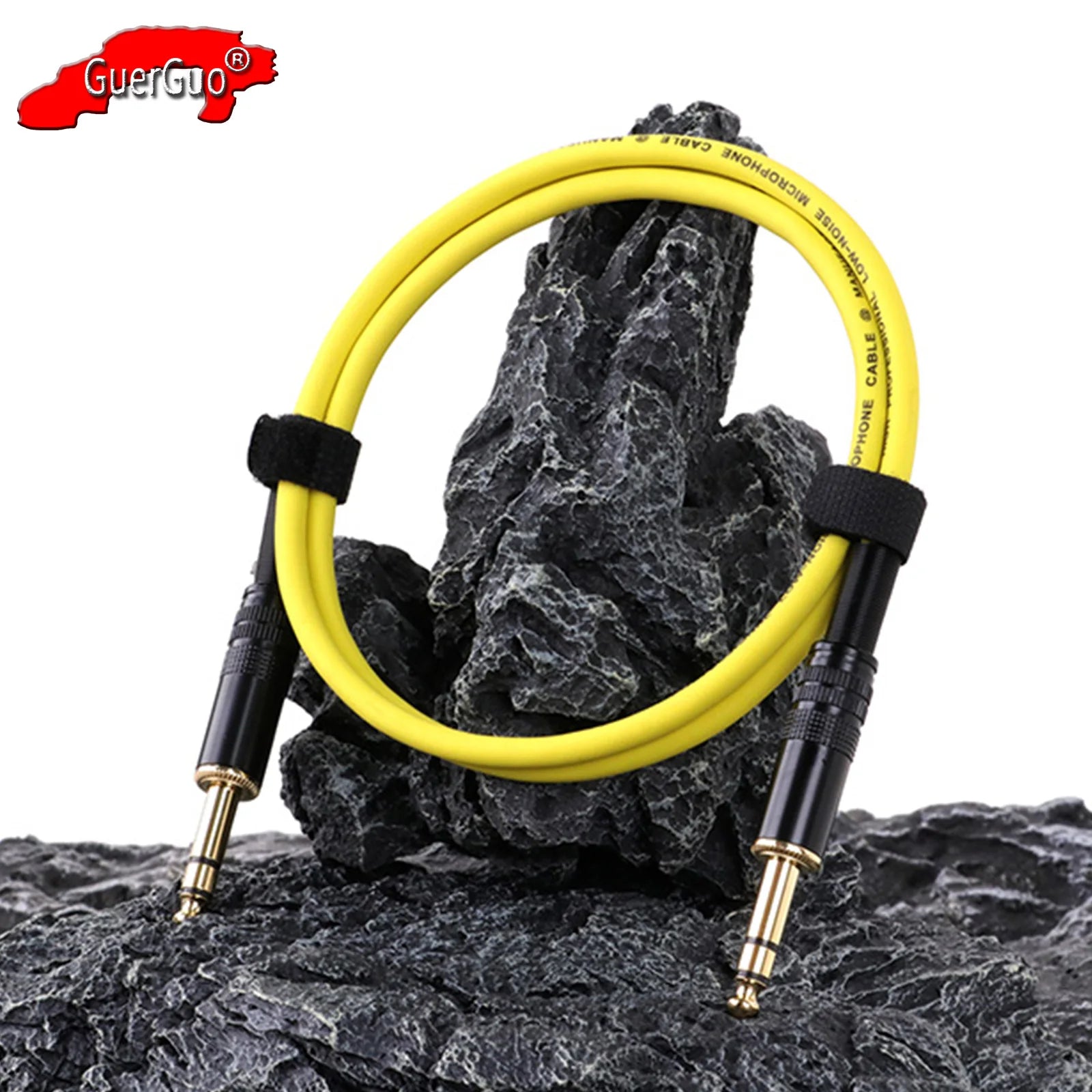 Yellow audio cable with black connectors on a rocky surface, featuring GuerGuo logo.