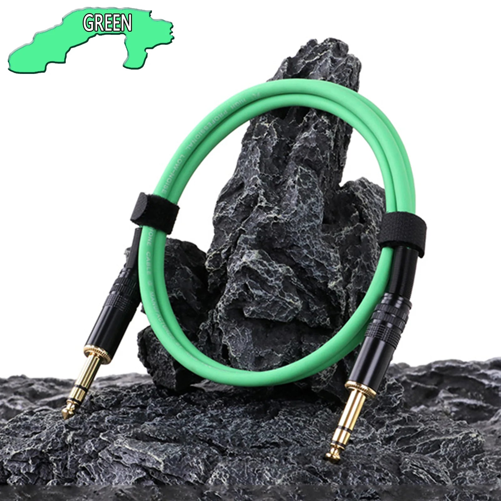 Green audio cable coiled on a rocky surface with a label indicating the color.