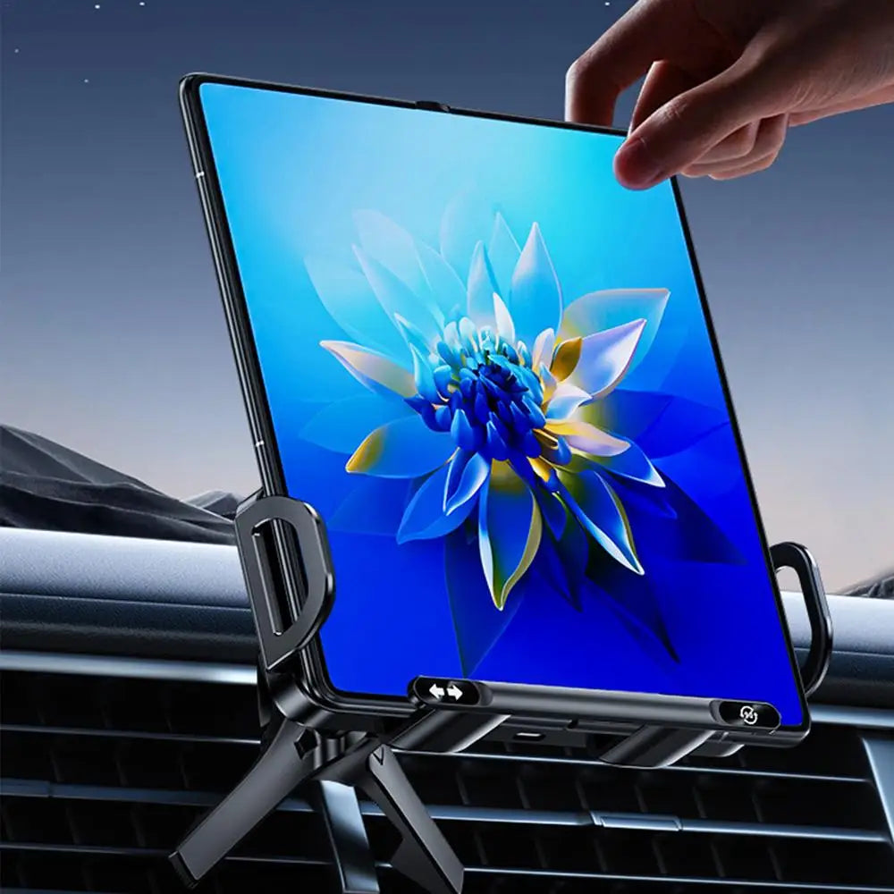 Smartphone with a floral display held by a hand, placed on a car air vent.