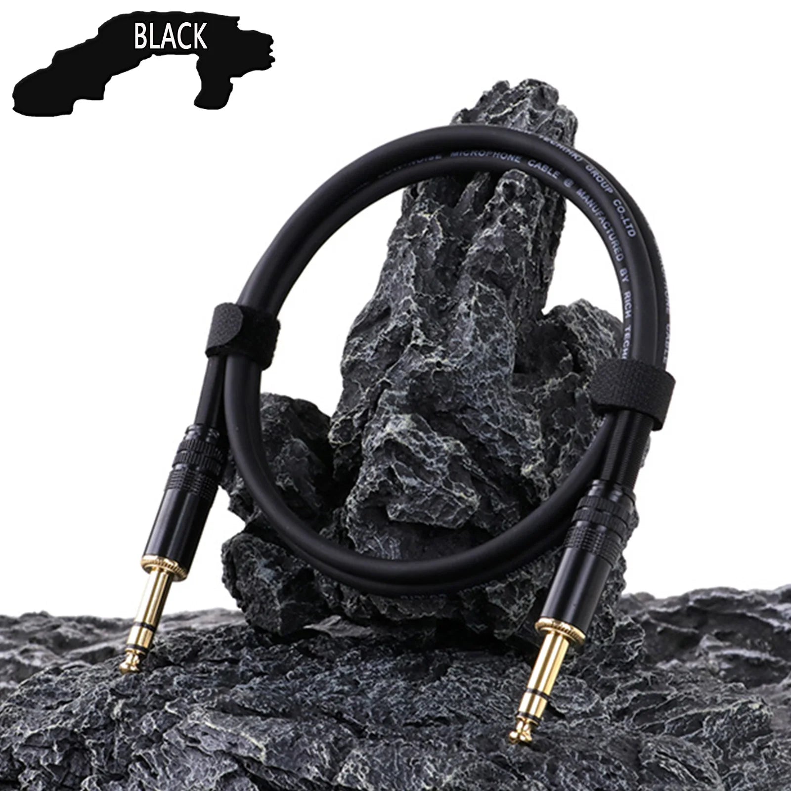 Black audio cable with gold connectors on a rocky surface, labeled 'Black'.