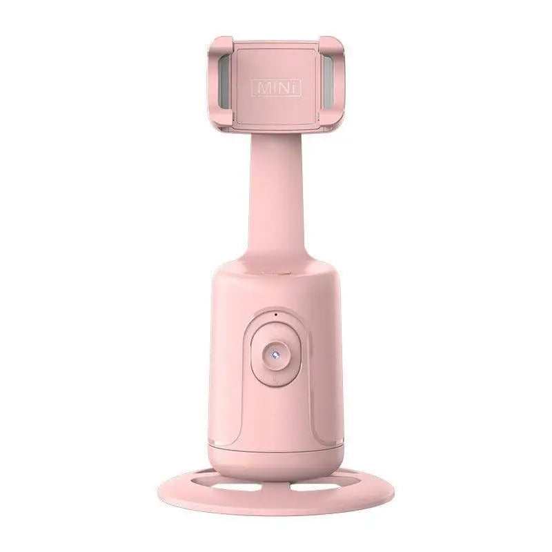 Pink handheld device with a stand on a white background