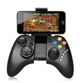 Black gaming controller with smartphone displaying a game on a white background