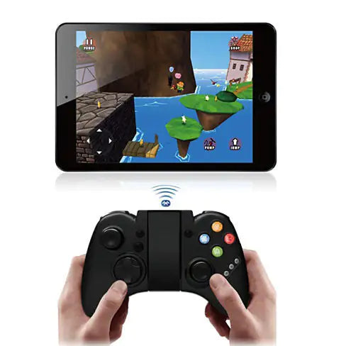 Tablet displaying a game with a wireless gaming controller held by hands.