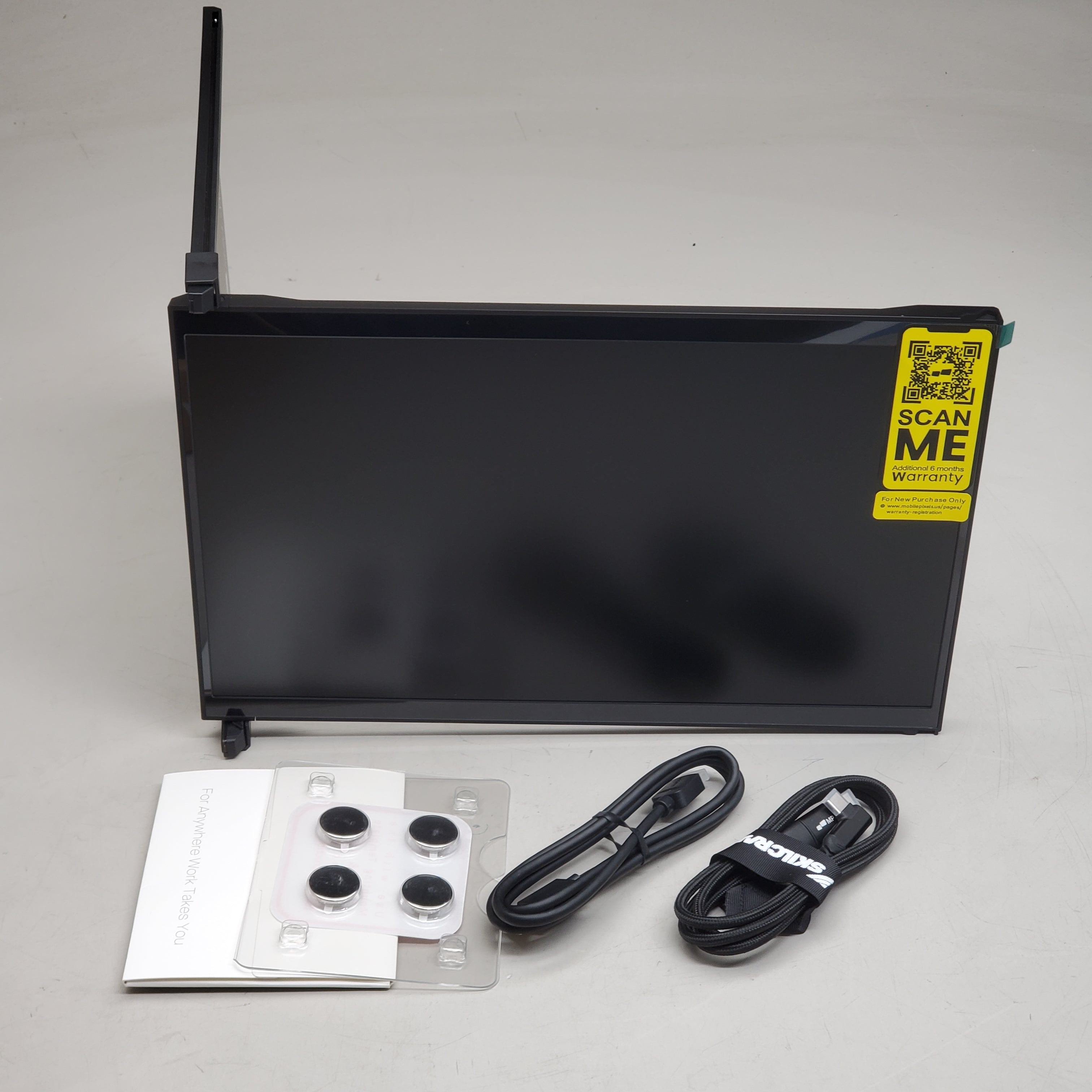 Electronic device with cables and mounting hardware on a gray background